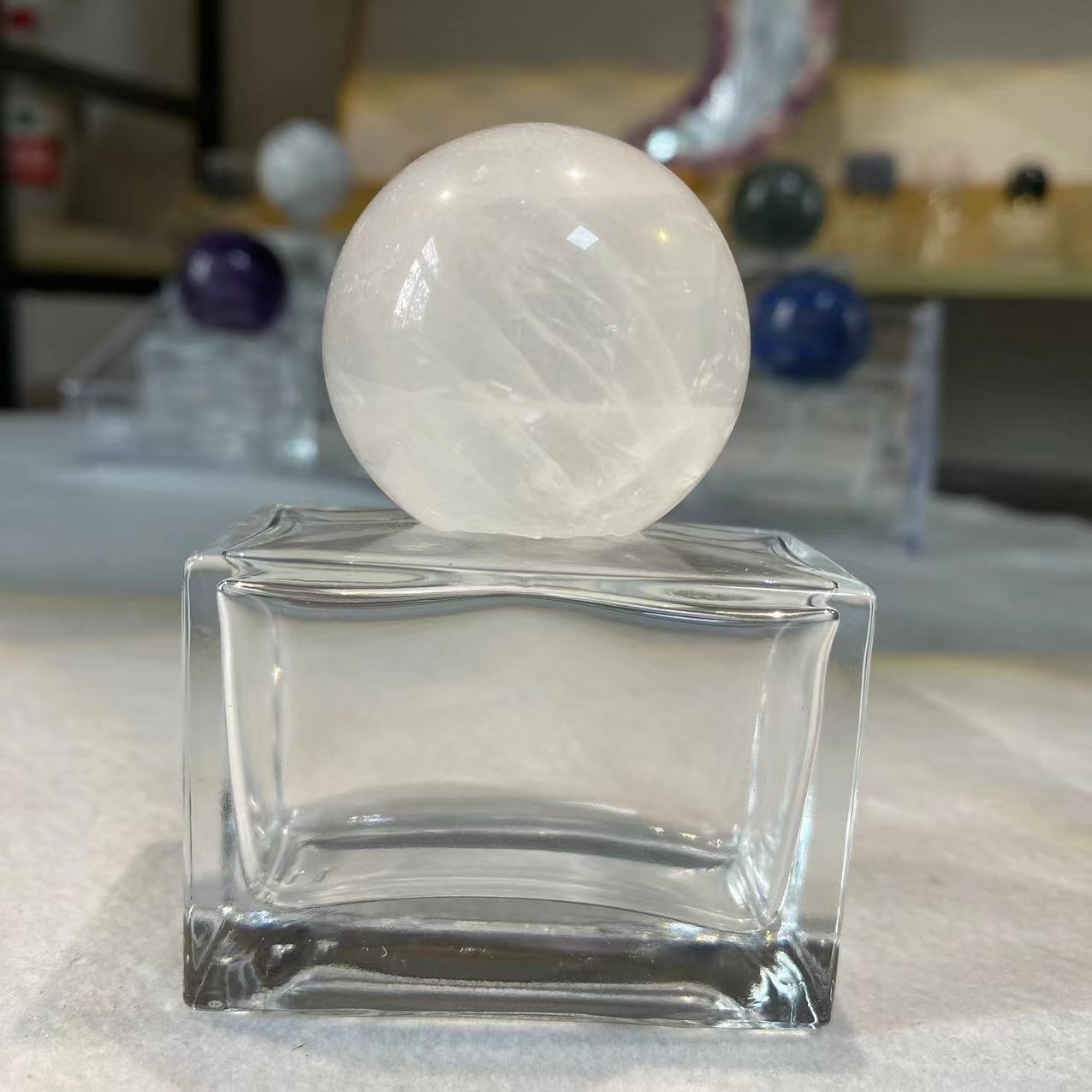 Raw stone pink crystal / amethyst spherical cap for perfume and aromatherapy bottles.